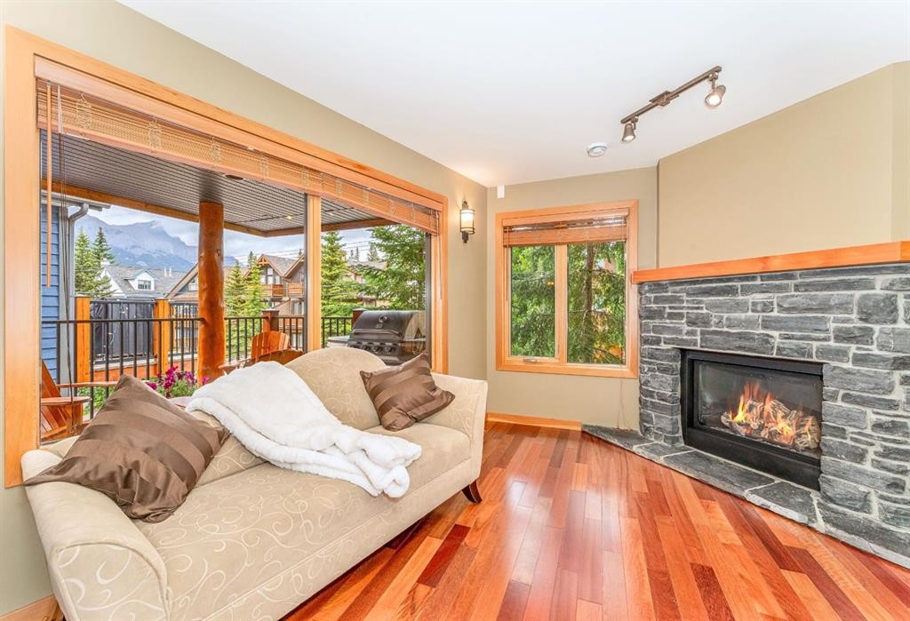 2-722 3Rd Street, Canmore, AB - Indoor Photo Showing Living Room With Fireplace