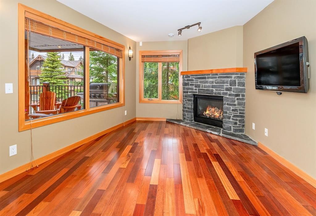 2-722 3Rd Street, Canmore, AB - Indoor Photo Showing Living Room With Fireplace