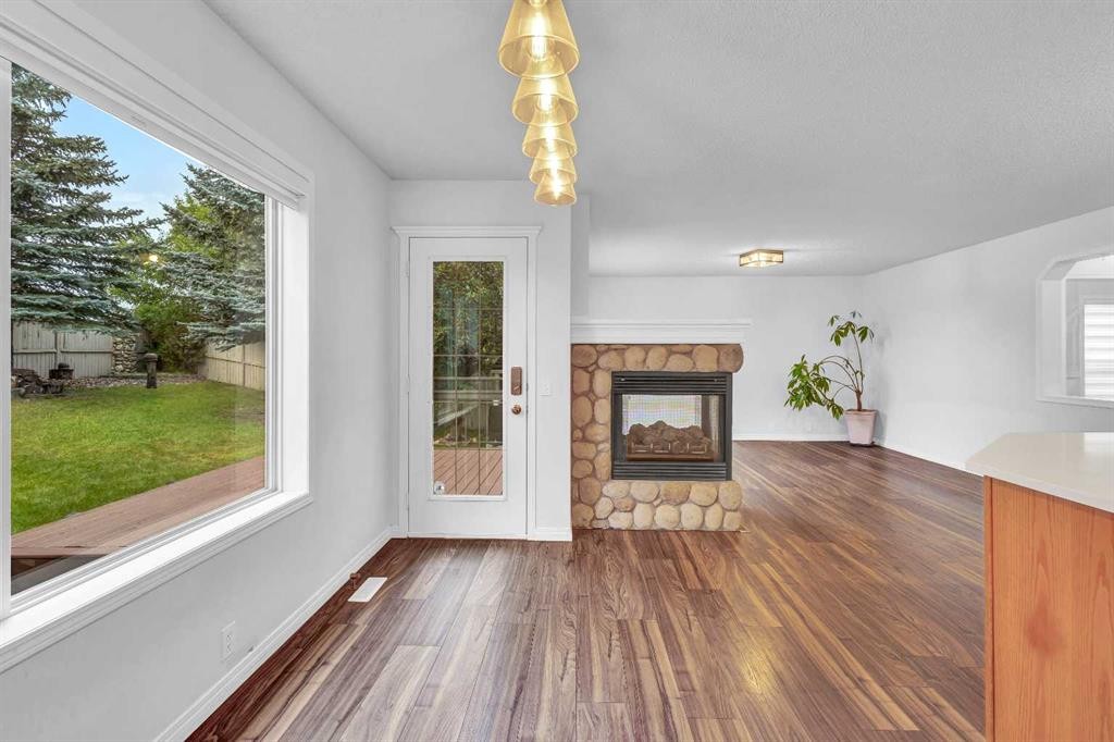 331 Springbank Place Sw, Calgary, AB - Indoor Photo Showing Other Room With Fireplace
