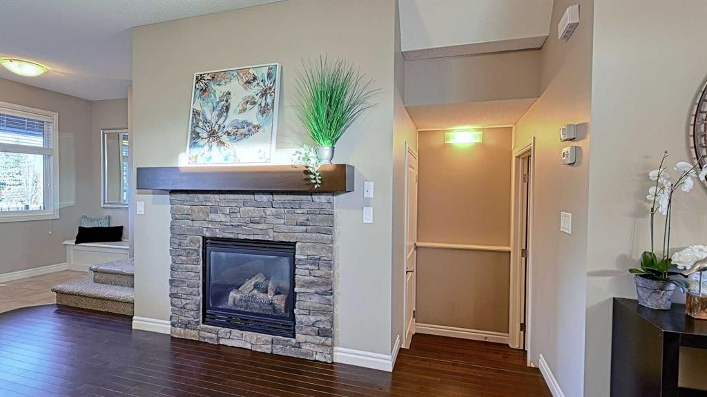 12 Legacy Gate Se, Calgary, AB - Indoor Photo Showing Living Room With Fireplace