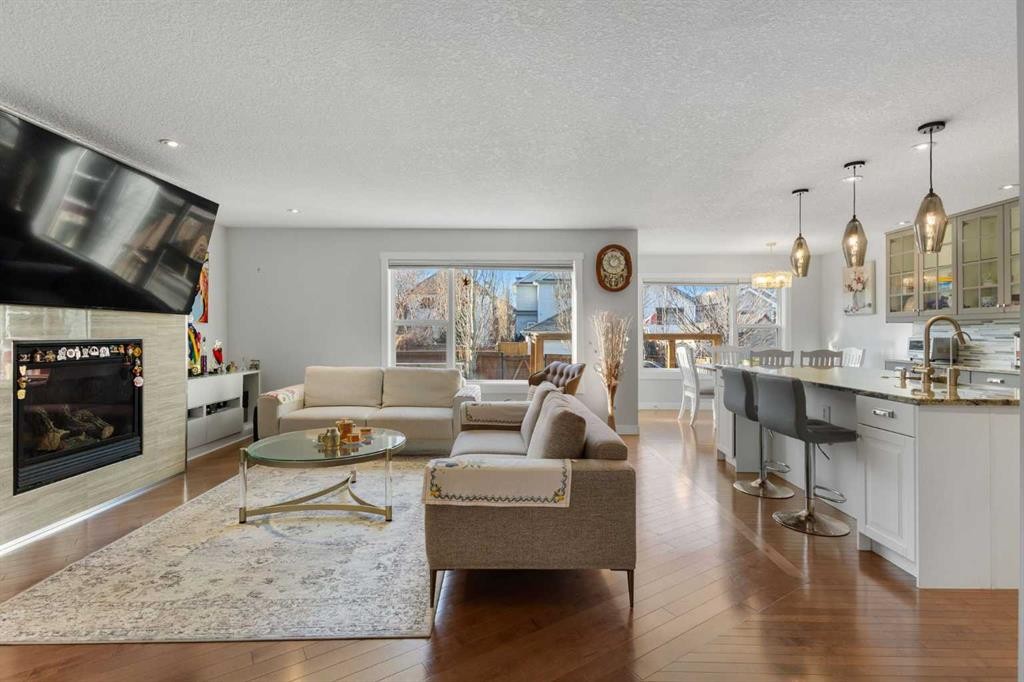 109 Copperfield Common Se, Calgary, AB - Indoor Photo Showing Living Room With Fireplace