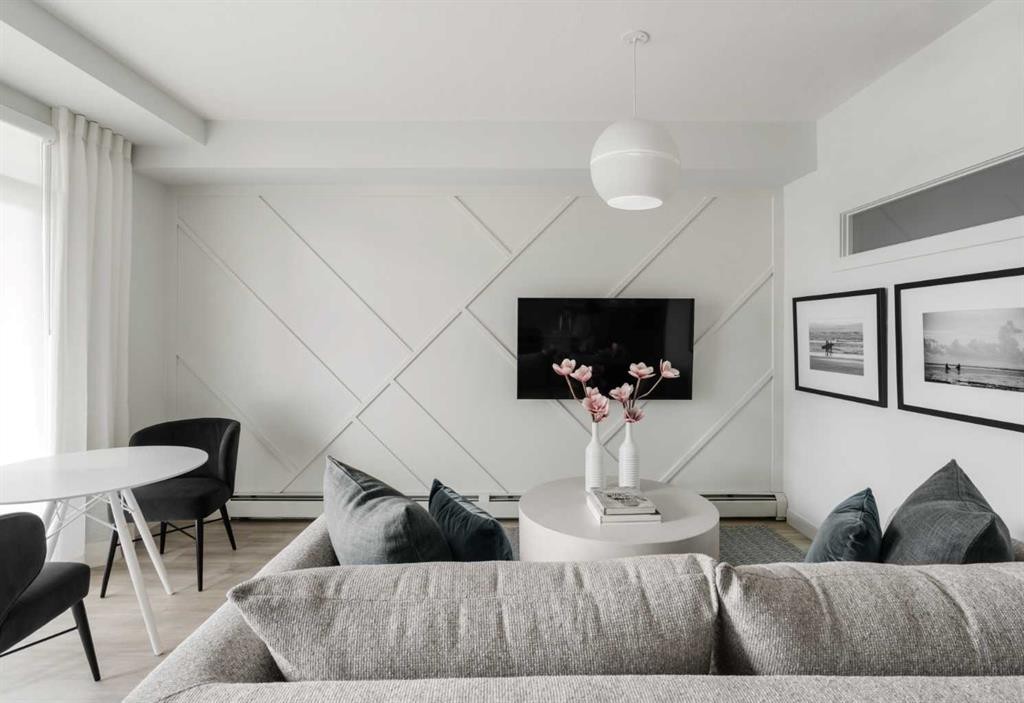 210-60 Water Cove Se, Calgary, AB - Indoor Photo Showing Living Room