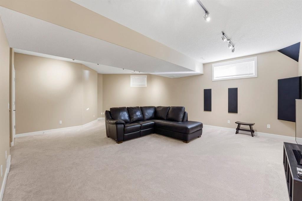 33 Prominence Park Sw, Calgary, AB - Indoor Photo Showing Basement