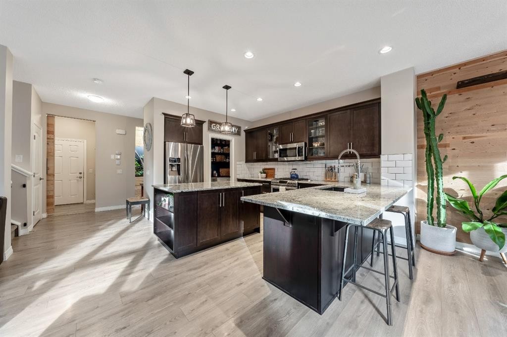 159 Riviera View, Cochrane, AB - Indoor Photo Showing Kitchen With Stainless Steel Kitchen With Upgraded Kitchen
