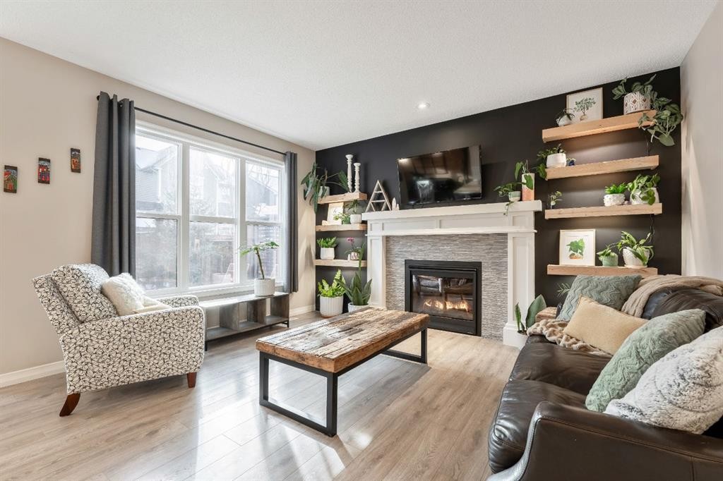 159 Riviera View, Cochrane, AB - Indoor Photo Showing Living Room With Fireplace