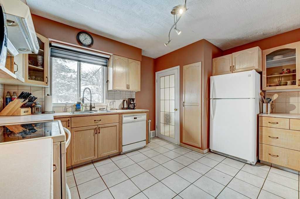 1455 Russell Road Ne, Calgary, AB - Indoor Photo Showing Kitchen With Double Sink