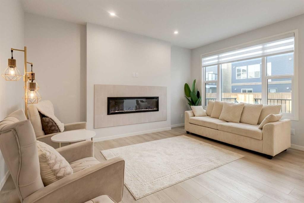 29 Marmot Passage Nw, Calgary, AB - Indoor Photo Showing Living Room With Fireplace
