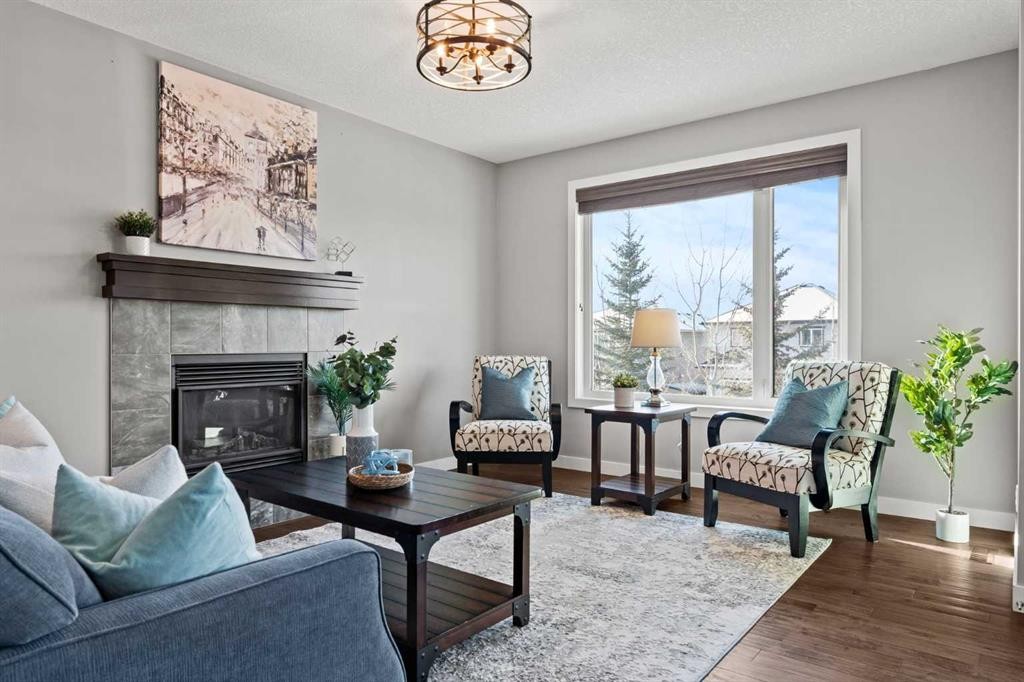 69 Ravenskirk Close Se, Airdrie, AB - Indoor Photo Showing Living Room With Fireplace