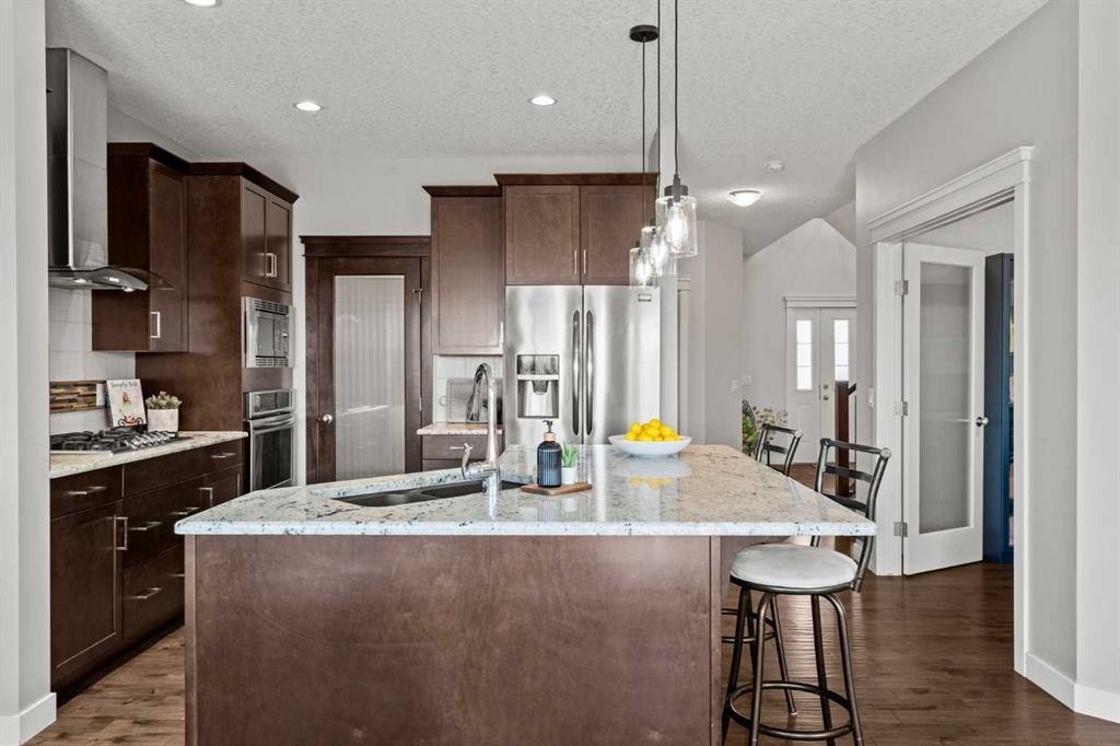 69 Ravenskirk Close Se, Airdrie, AB - Indoor Photo Showing Kitchen With Upgraded Kitchen