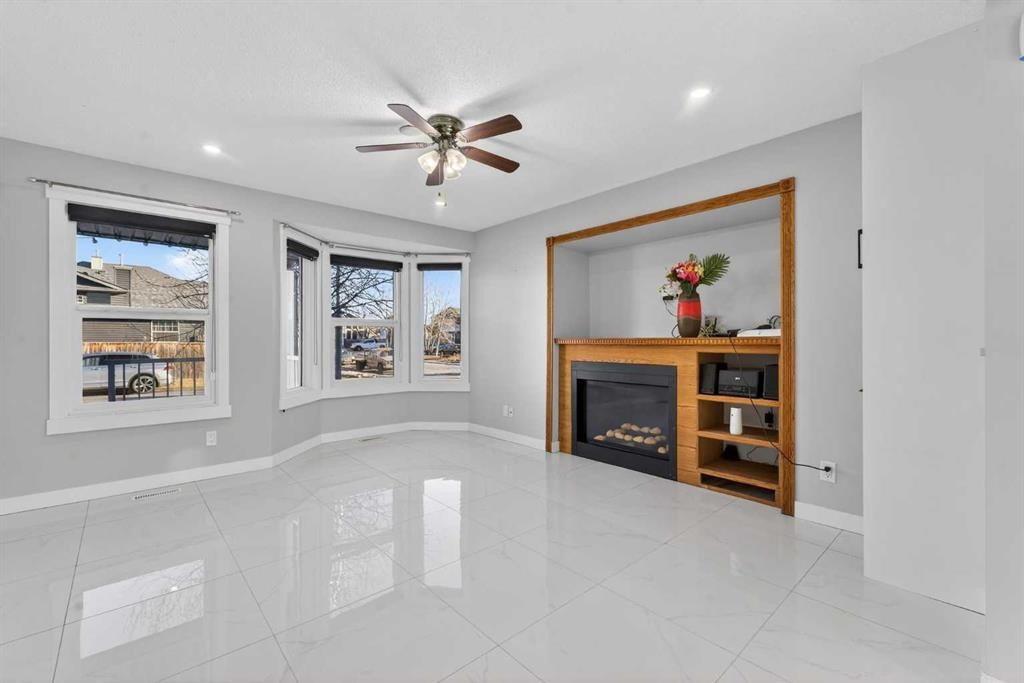 49 Taravista Way Ne, Calgary, AB - Indoor With Fireplace