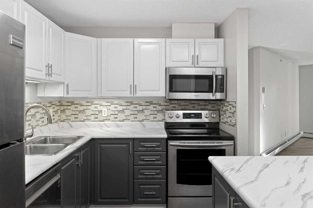 1408-1000 Somervale Court Sw, Calgary, AB - Indoor Photo Showing Kitchen With Double Sink