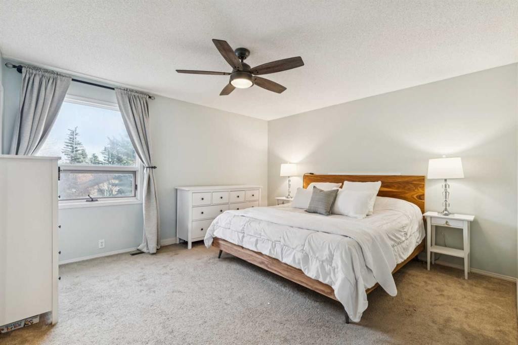 124 Woodmark Crescent Sw, Calgary, AB - Indoor Photo Showing Bedroom