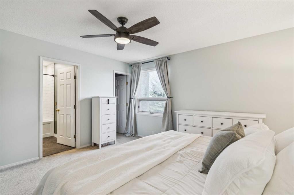 124 Woodmark Crescent Sw, Calgary, AB - Indoor Photo Showing Bedroom