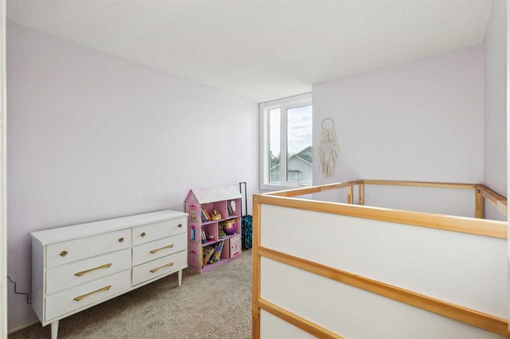 124 Woodmark Crescent Sw, Calgary, AB - Indoor Photo Showing Other Room