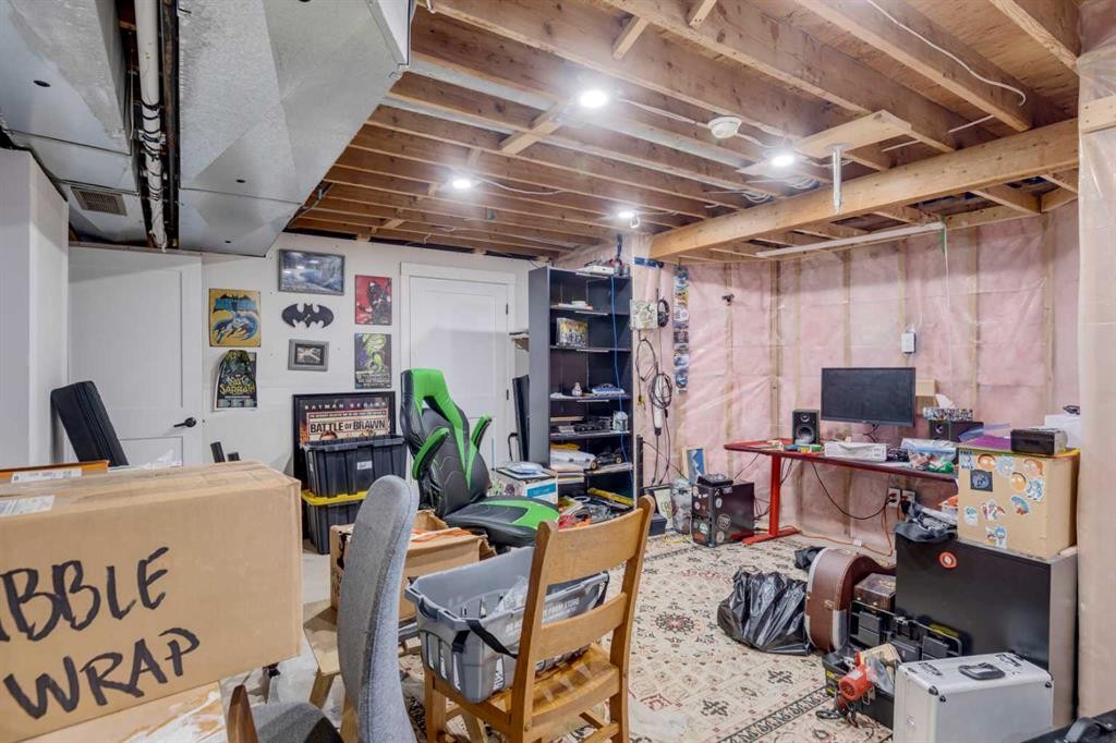 124 Woodmark Crescent Sw, Calgary, AB - Indoor Photo Showing Basement