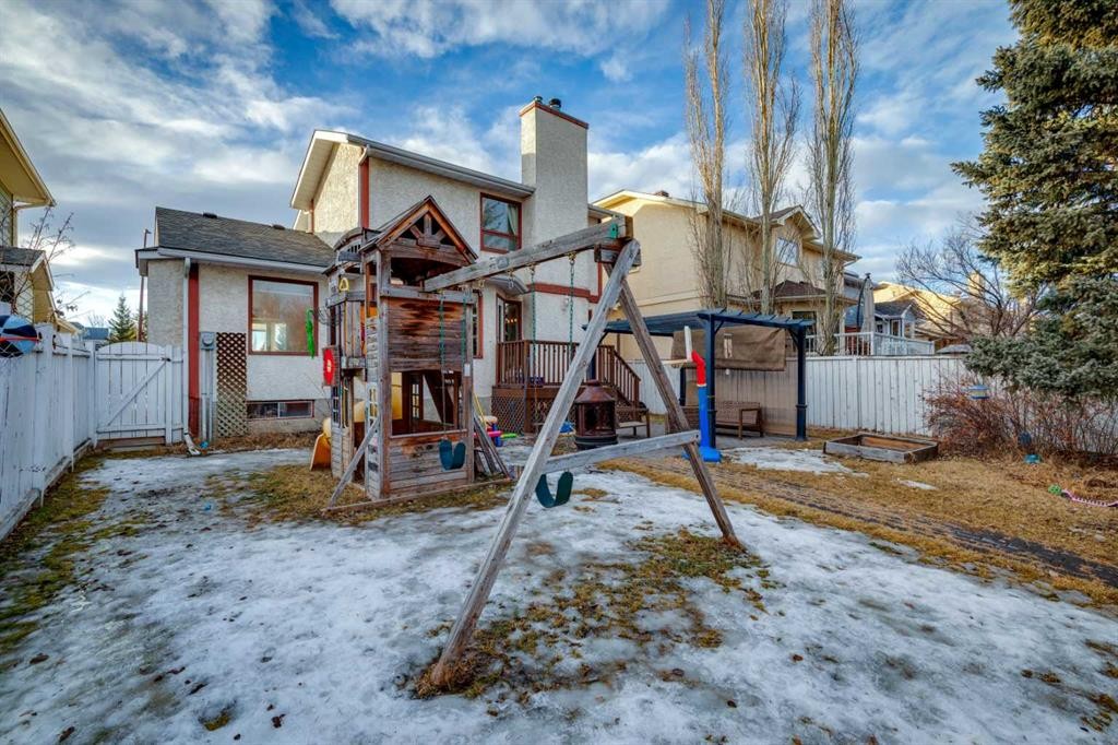 124 Woodmark Crescent Sw, Calgary, AB - Outdoor