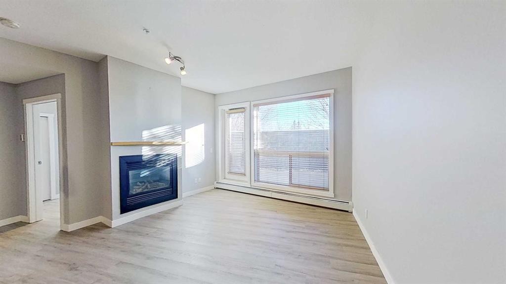 121-69 Springborough Court Sw, Calgary, AB - Indoor With Fireplace