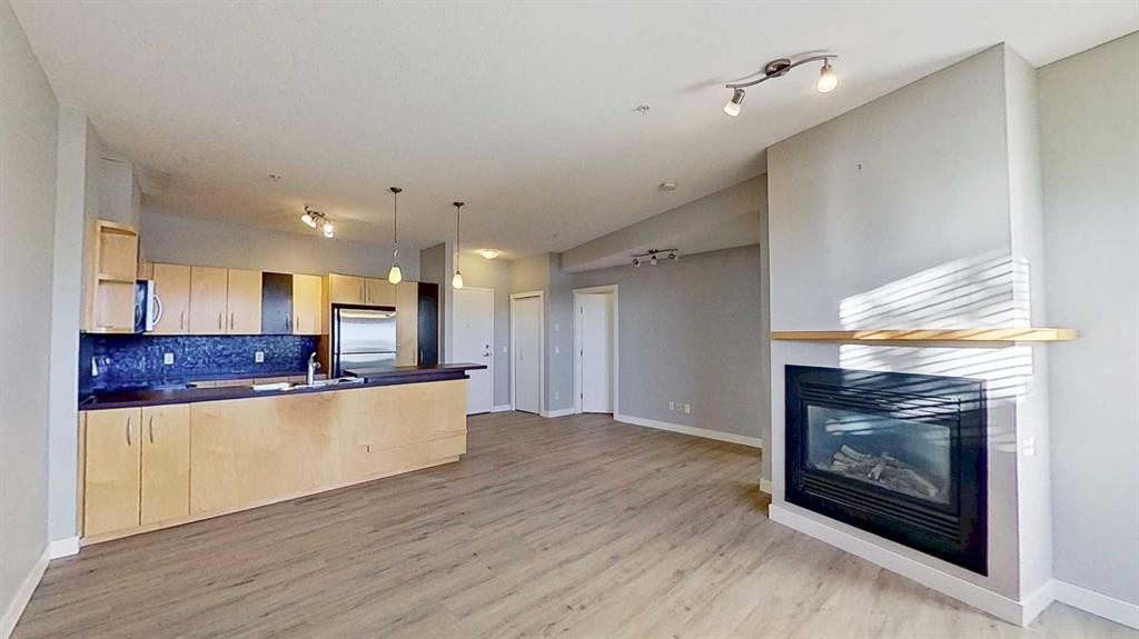 121-69 Springborough Court Sw, Calgary, AB - Indoor With Fireplace