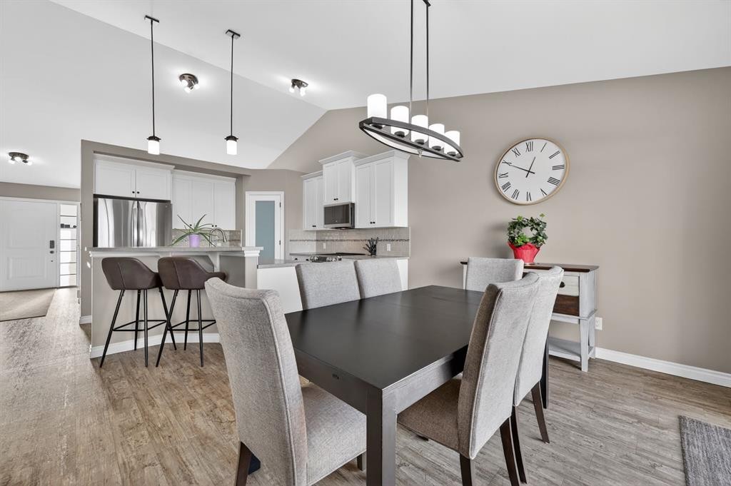 26 Mackenzie Way, Carstairs, AB - Indoor Photo Showing Dining Room