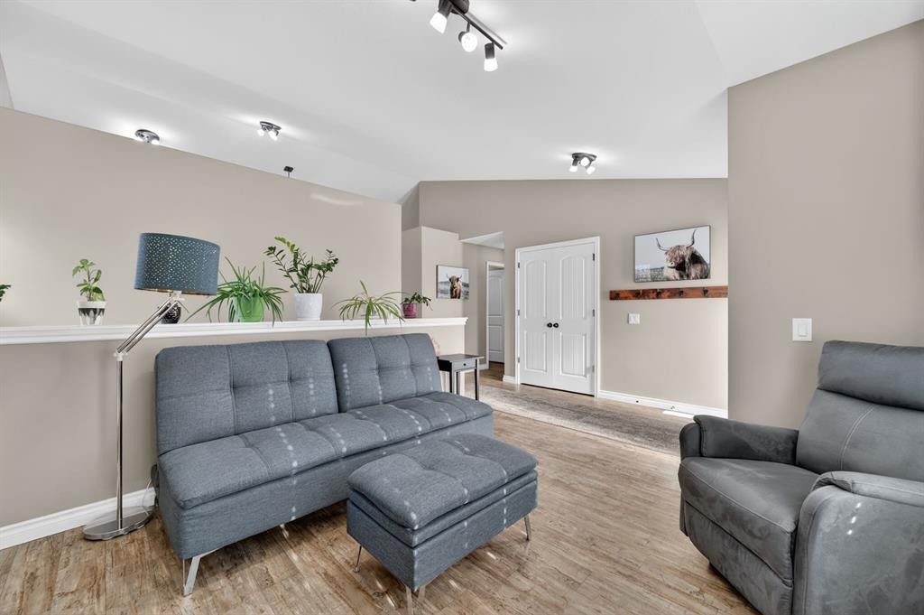 26 Mackenzie Way, Carstairs, AB - Indoor Photo Showing Living Room