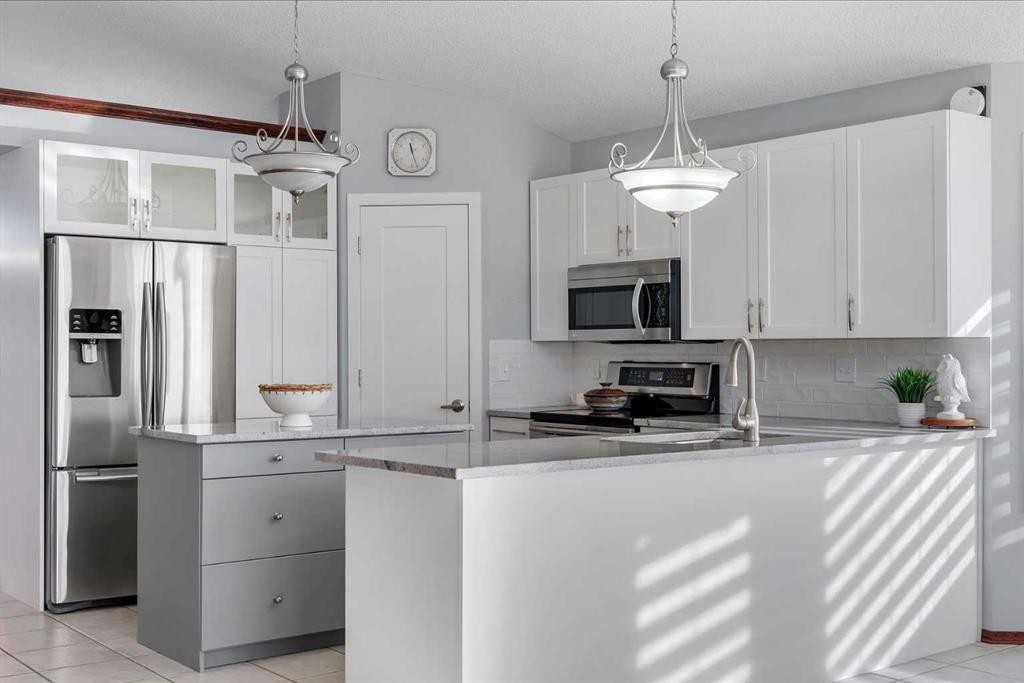 78 Mckenzie Lake Place Se, Calgary, AB - Indoor Photo Showing Kitchen With Double Sink With Upgraded Kitchen