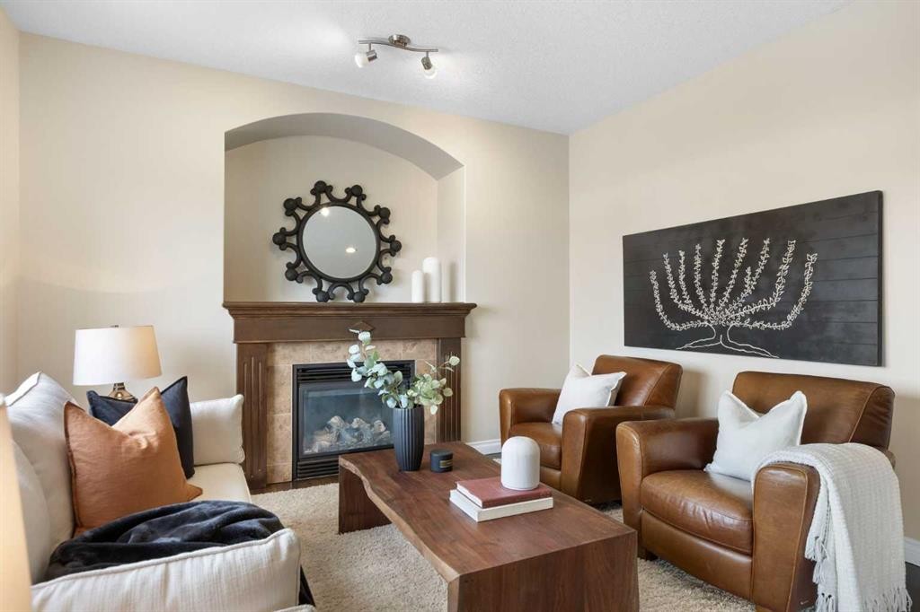 100 Lakeside View, Strathmore, AB - Indoor Photo Showing Living Room With Fireplace