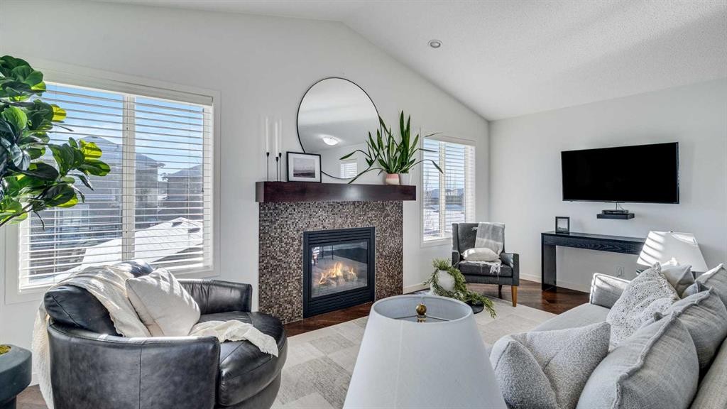 389 Cranberry Circle Se, Calgary, AB - Indoor Photo Showing Living Room With Fireplace