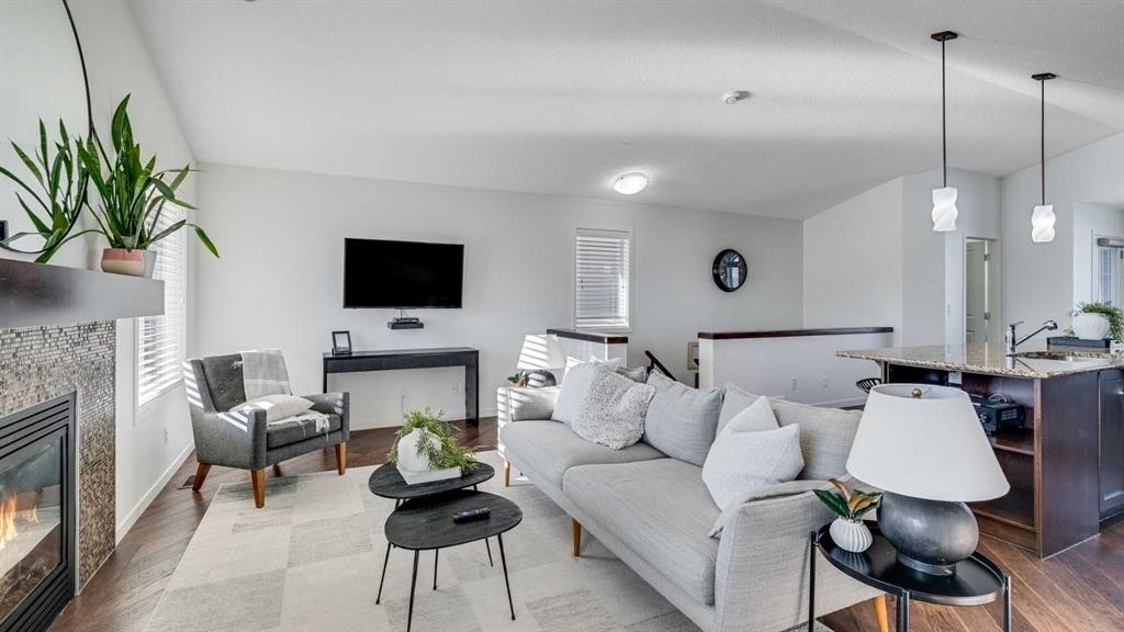 389 Cranberry Circle Se, Calgary, AB - Indoor Photo Showing Living Room With Fireplace