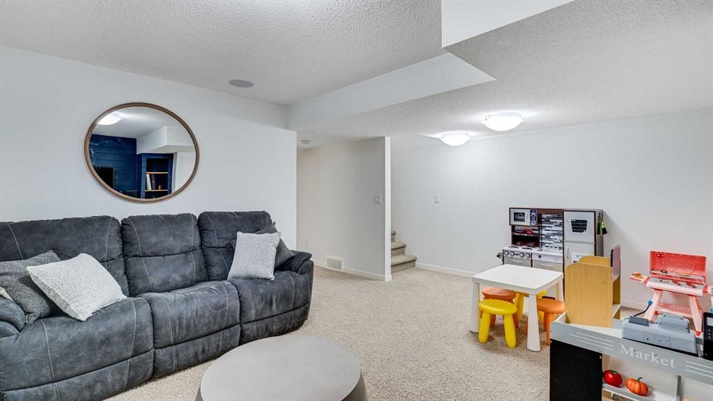 389 Cranberry Circle Se, Calgary, AB - Indoor Photo Showing Living Room