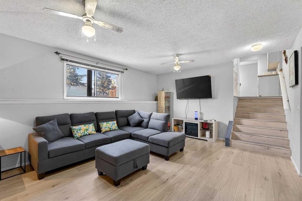 195 Fallswater Road Ne, Calgary, AB - Indoor Photo Showing Living Room