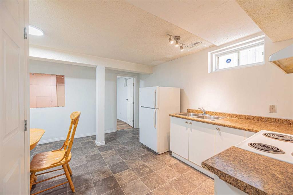 38 Martindale Drive Ne, Calgary, AB - Indoor Photo Showing Kitchen With Double Sink