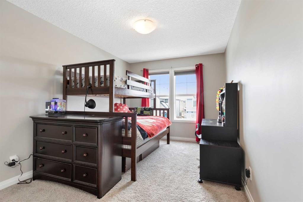 26 Marquis Heights Se, Calgary, AB - Indoor Photo Showing Bedroom