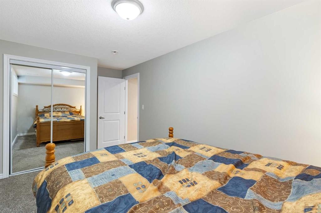 26 Marquis Heights Se, Calgary, AB - Indoor Photo Showing Bedroom