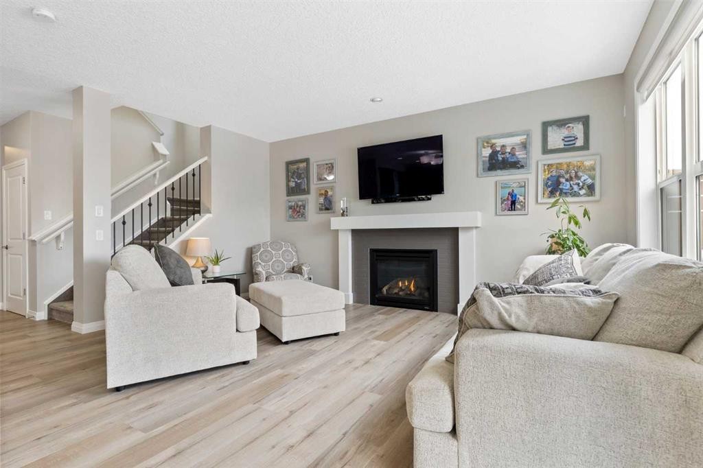 26 Marquis Heights Se, Calgary, AB - Indoor Photo Showing Living Room With Fireplace