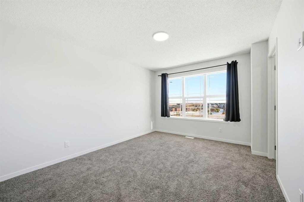 185 Edith Green Nw, Calgary, AB - Indoor Photo Showing Other Room