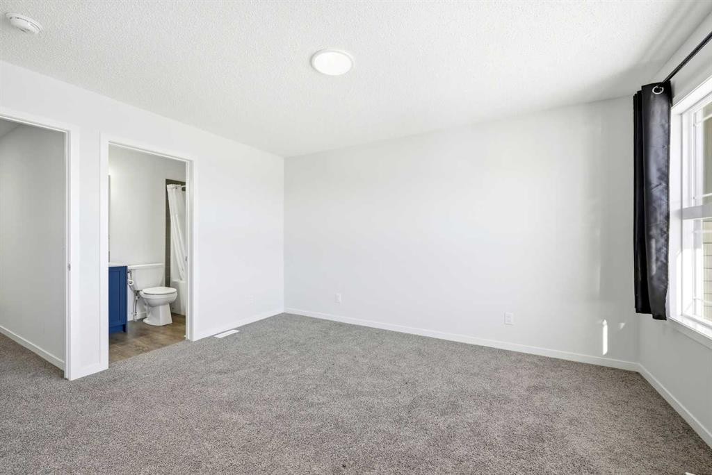 185 Edith Green Nw, Calgary, AB - Indoor Photo Showing Other Room