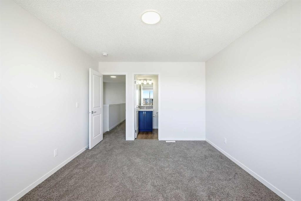 185 Edith Green Nw, Calgary, AB - Indoor Photo Showing Other Room