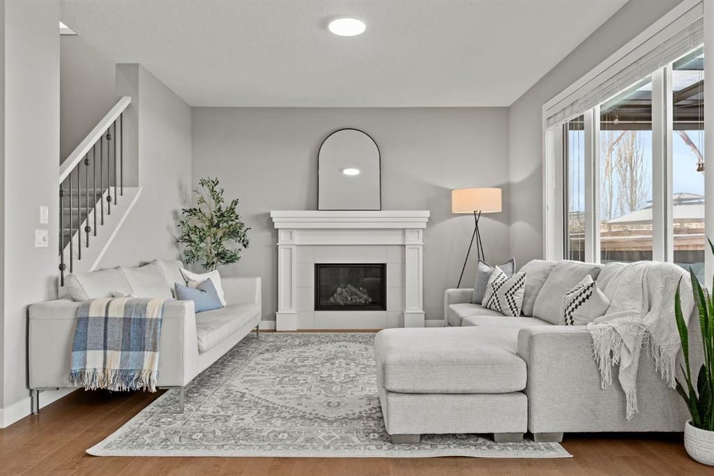 85 Mount Rae Heights, Okotoks, AB - Indoor Photo Showing Living Room With Fireplace