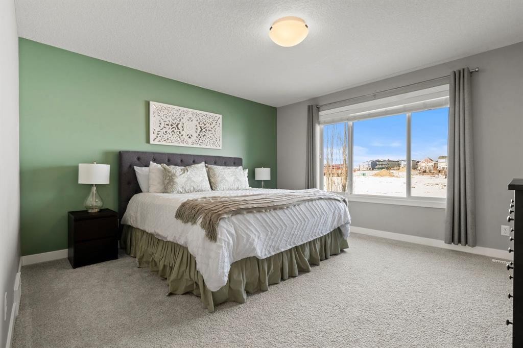 85 Mount Rae Heights, Okotoks, AB - Indoor Photo Showing Bedroom