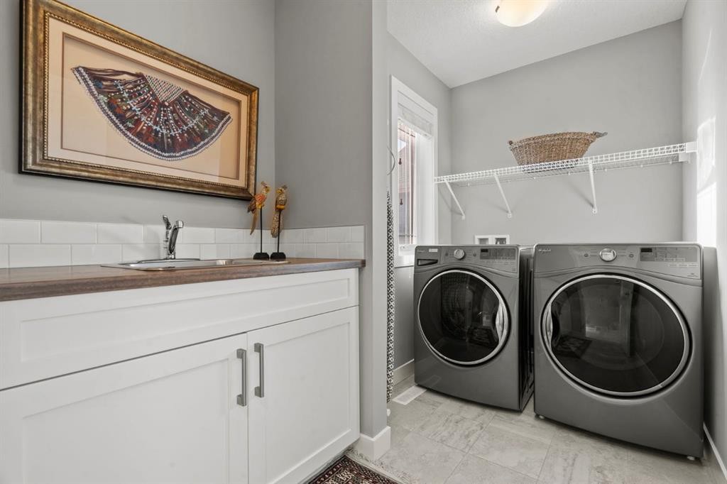 85 Mount Rae Heights, Okotoks, AB - Indoor Photo Showing Laundry Room