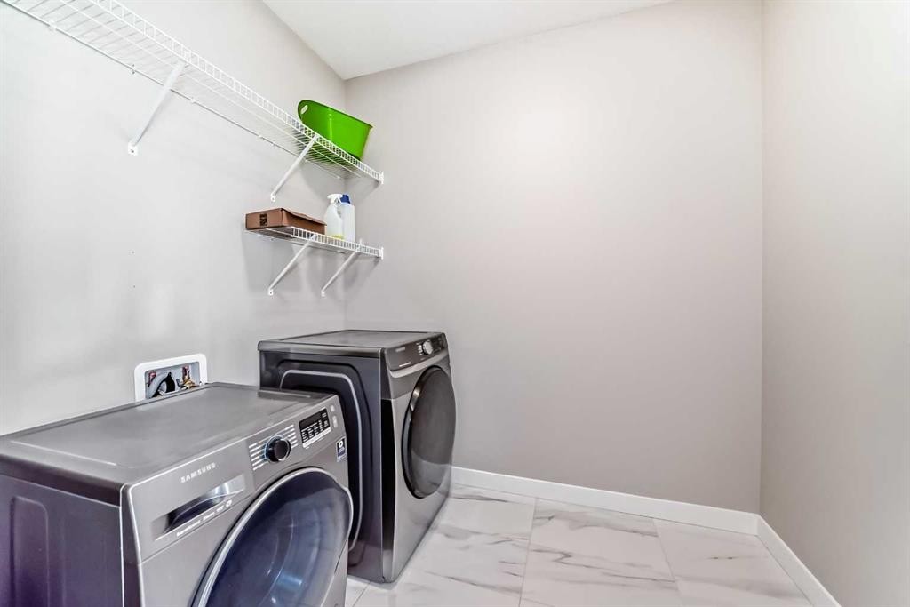 41 Shawnee Green Sw, Calgary, AB - Indoor Photo Showing Laundry Room