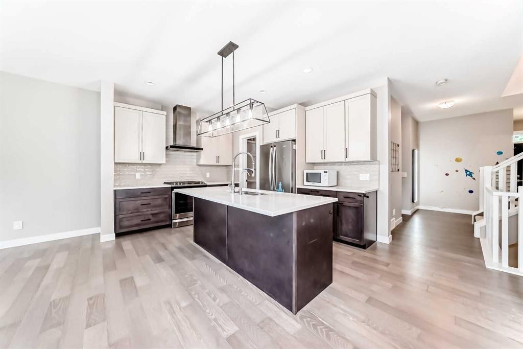 41 Shawnee Green Sw, Calgary, AB - Indoor Photo Showing Kitchen With Stainless Steel Kitchen With Upgraded Kitchen
