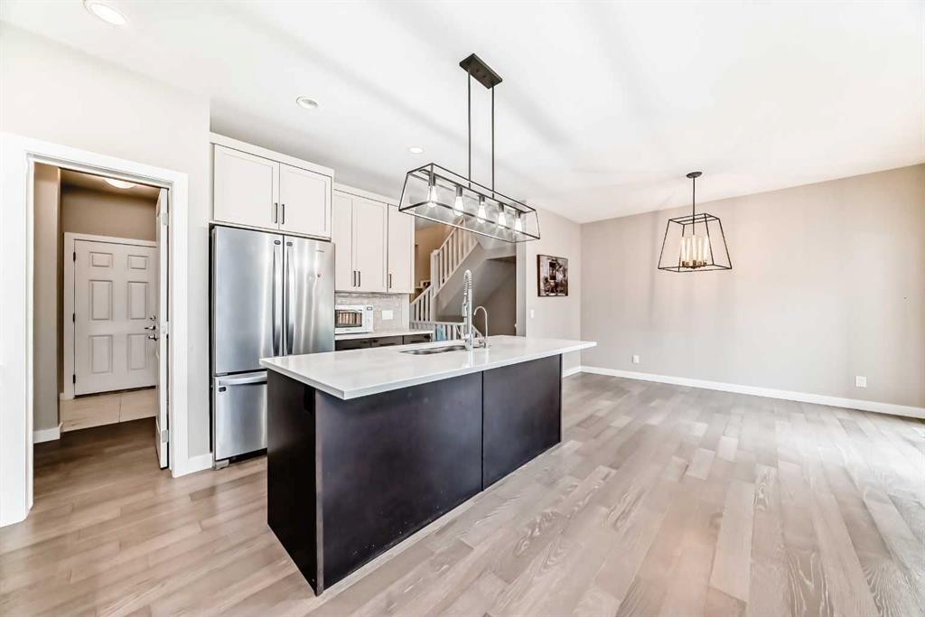 41 Shawnee Green Sw, Calgary, AB - Indoor Photo Showing Kitchen With Stainless Steel Kitchen With Upgraded Kitchen