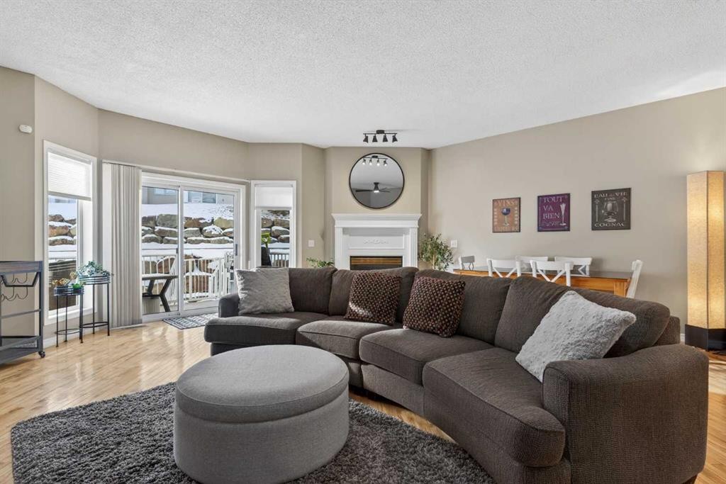 42 Hamptons Link Nw, Calgary, AB - Indoor Photo Showing Living Room With Fireplace