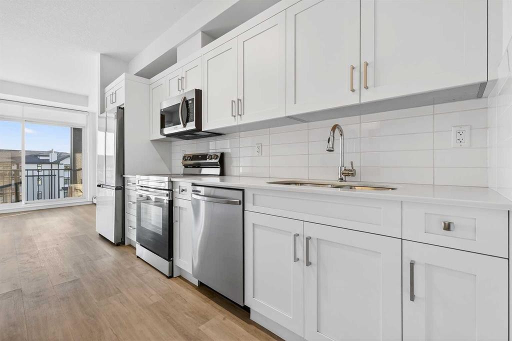 411-40 Sage Hill Walk Nw, Calgary, AB - Indoor Photo Showing Kitchen With Stainless Steel Kitchen With Upgraded Kitchen