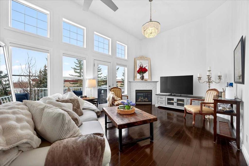 3 Tucker Circle, Okotoks, AB - Indoor Photo Showing Living Room With Fireplace