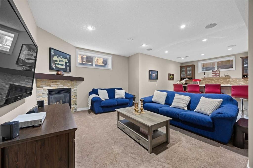 202 Royal Oak Heath Nw, Calgary, AB - Indoor Photo Showing Living Room With Fireplace