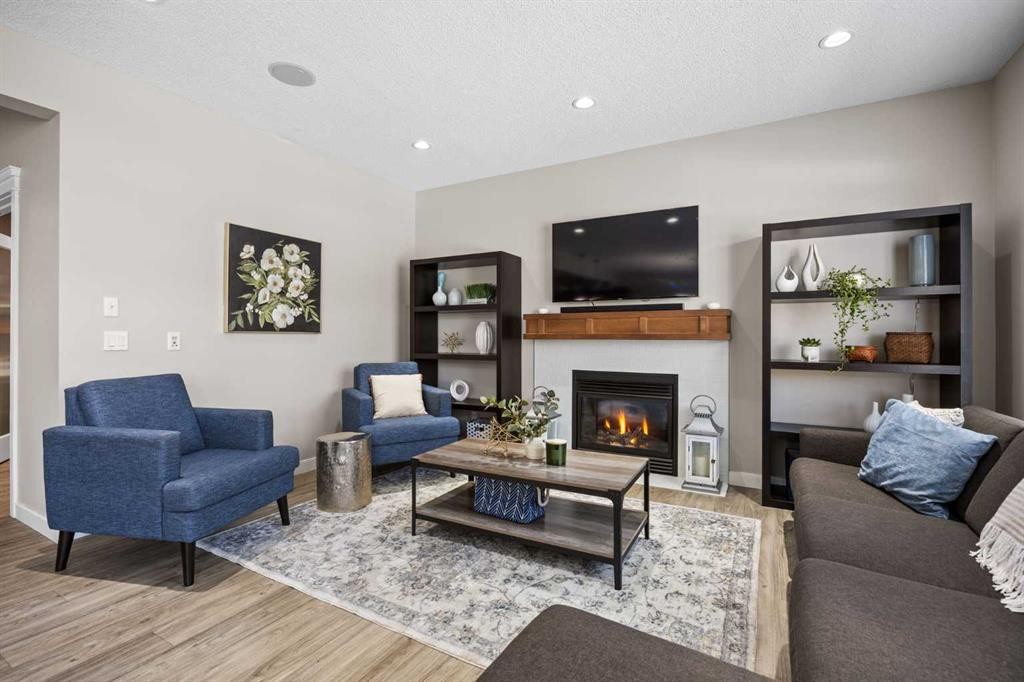 202 Royal Oak Heath Nw, Calgary, AB - Indoor Photo Showing Living Room With Fireplace