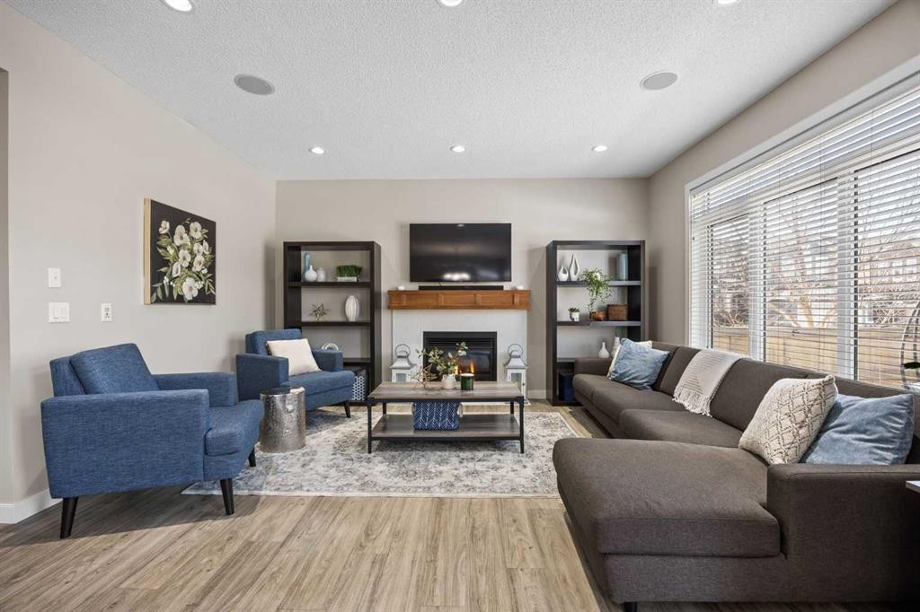 202 Royal Oak Heath Nw, Calgary, AB - Indoor Photo Showing Living Room With Fireplace