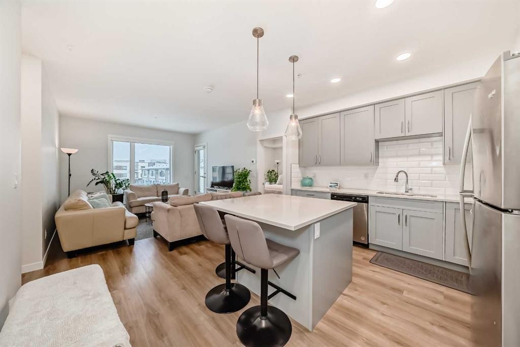 316-200 Shawnee Square Sw, Calgary, AB - Indoor Photo Showing Kitchen With Stainless Steel Kitchen With Upgraded Kitchen
